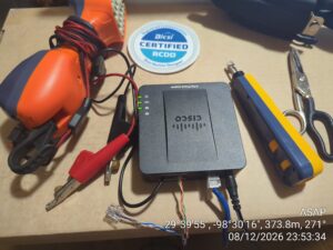 Cisco ATA analog telephone adapter configured for SIP trunking by a San Antonio IT support technician.