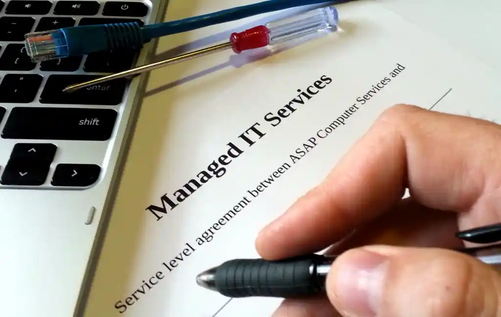 Managed IT services contract from ASAP Computer Services on desk for signature in San Antonio