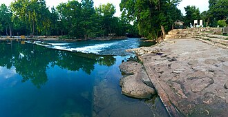 Small smooth waterfall on the San Marcos River in San Marcos, Texas