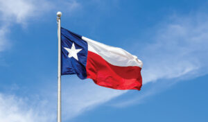Texas flag flying over a construction firm in San Antonio
